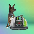 Bissell Carpet Cleaner with dog on green background