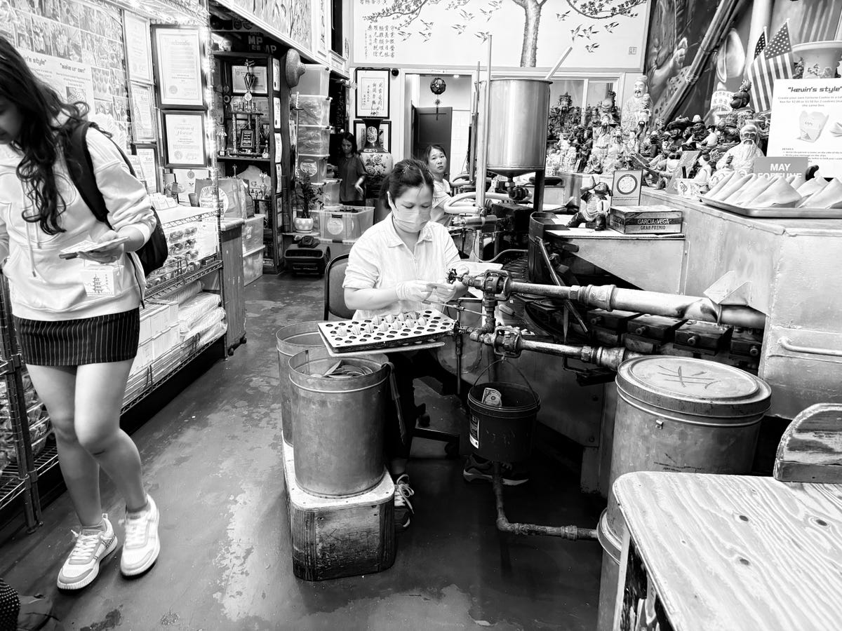 Women making fortune cookies in the Golden Gate Fortune Cookies company