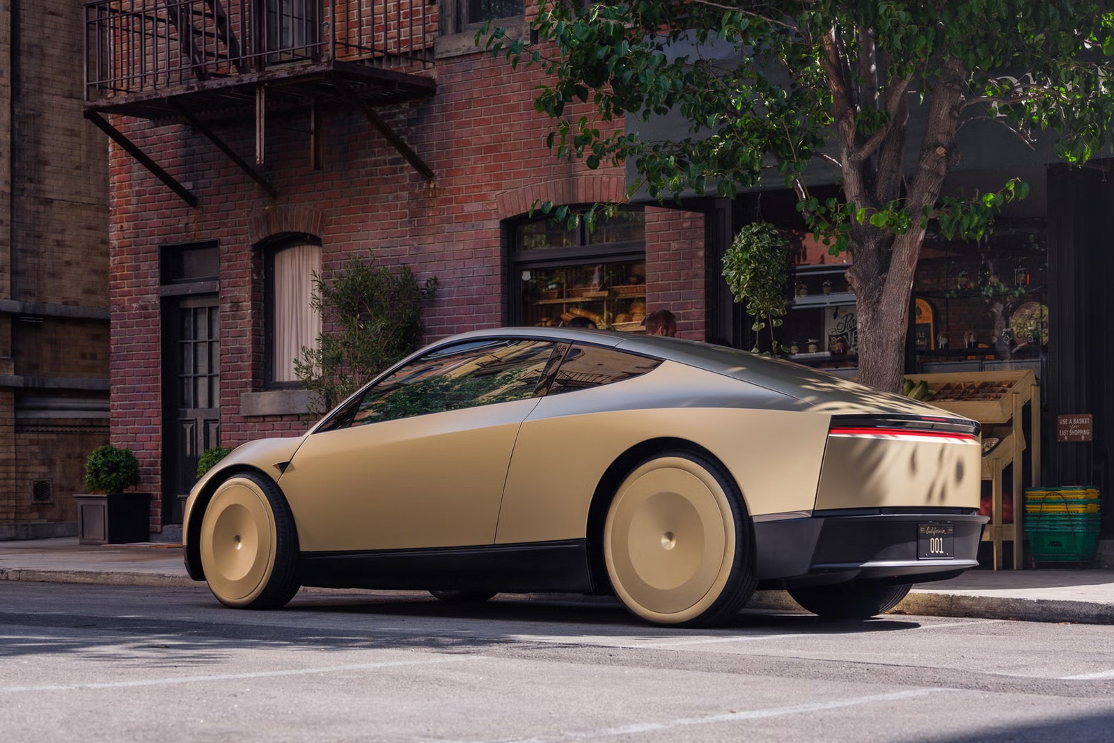 A gold Tesla on a city street