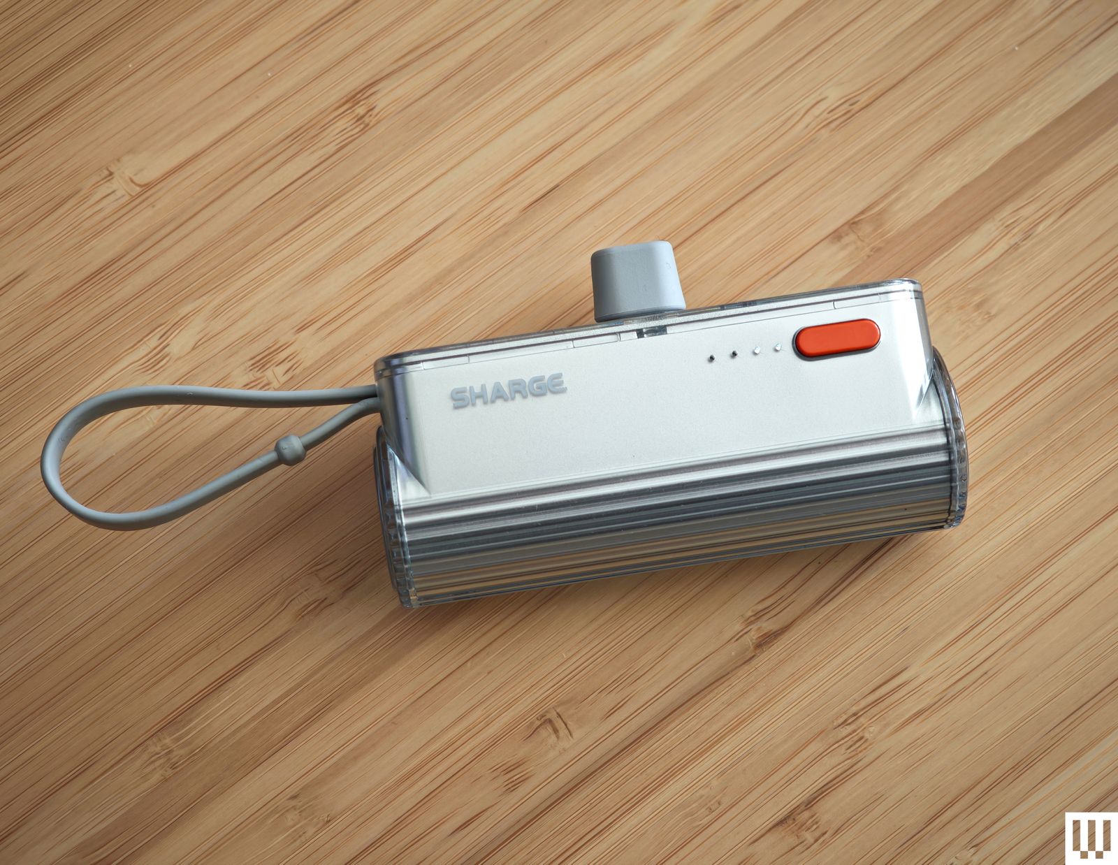 Sharge Flow Mini a silver rectangular power bank.