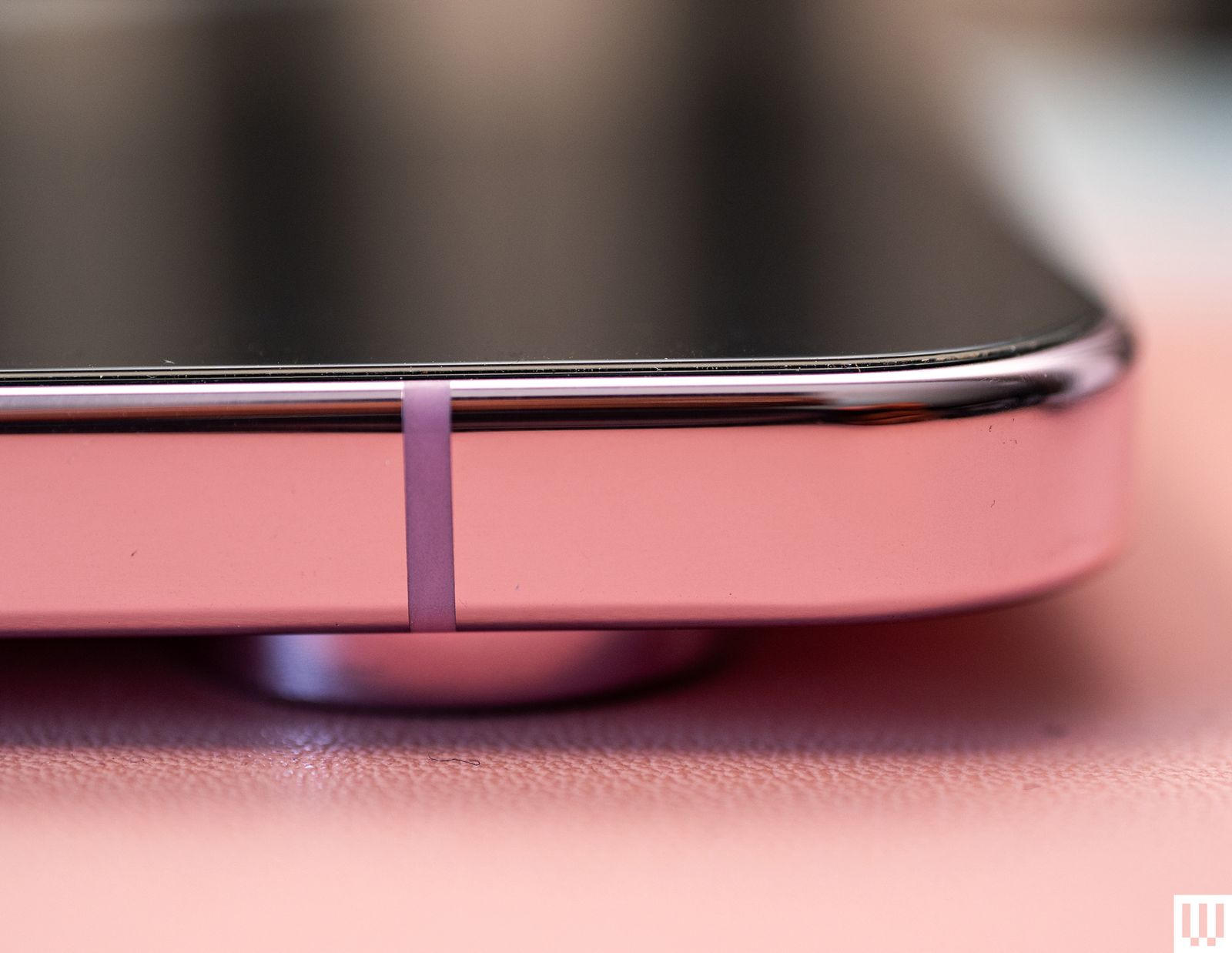 Closeup of a screen protector on a pink mobile phone