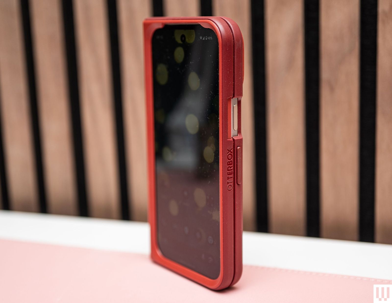 Red phone case with rounded edges in upright position