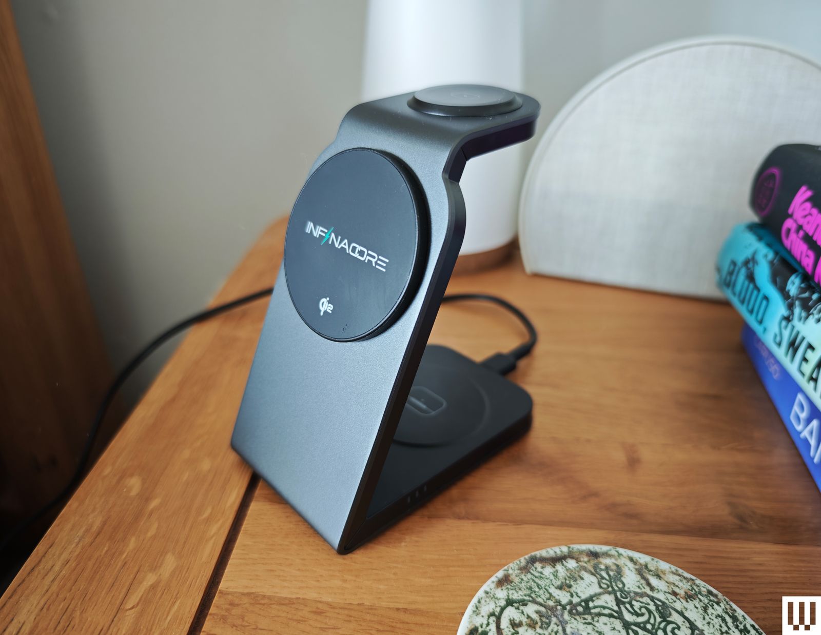 Infinacore T3 Pro a black angular charging stand