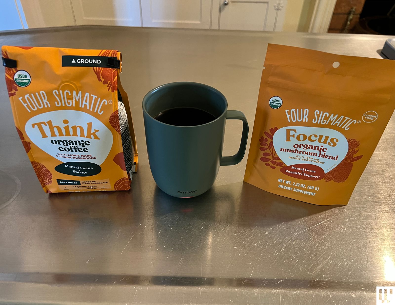 Best Mushroom Coffee Sigmatic Packaging and green cup of coffee