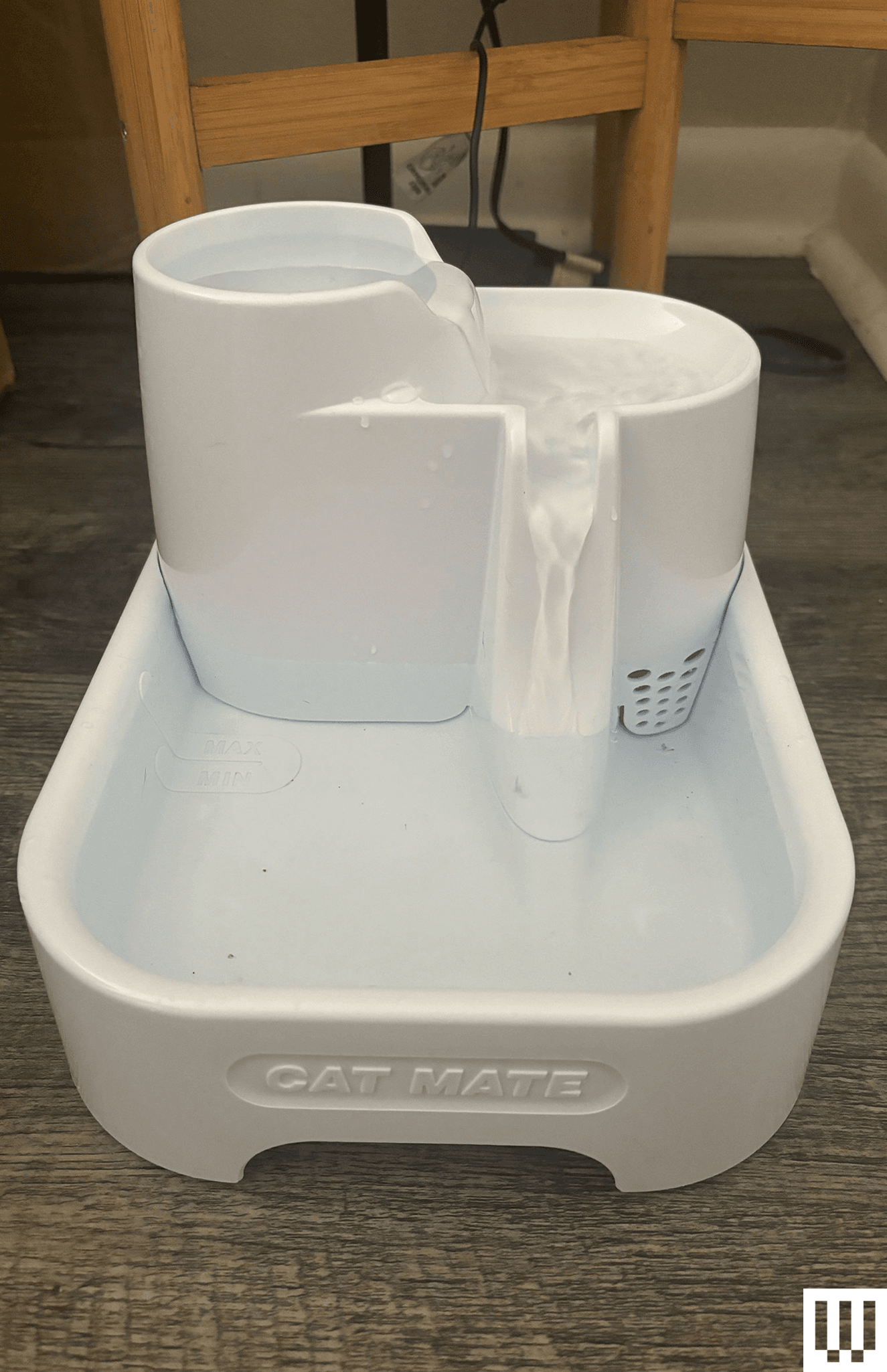 Cat Mate a 3level water fountain for pets with two levels for water to cascade down leading into a rectangular reservoir...