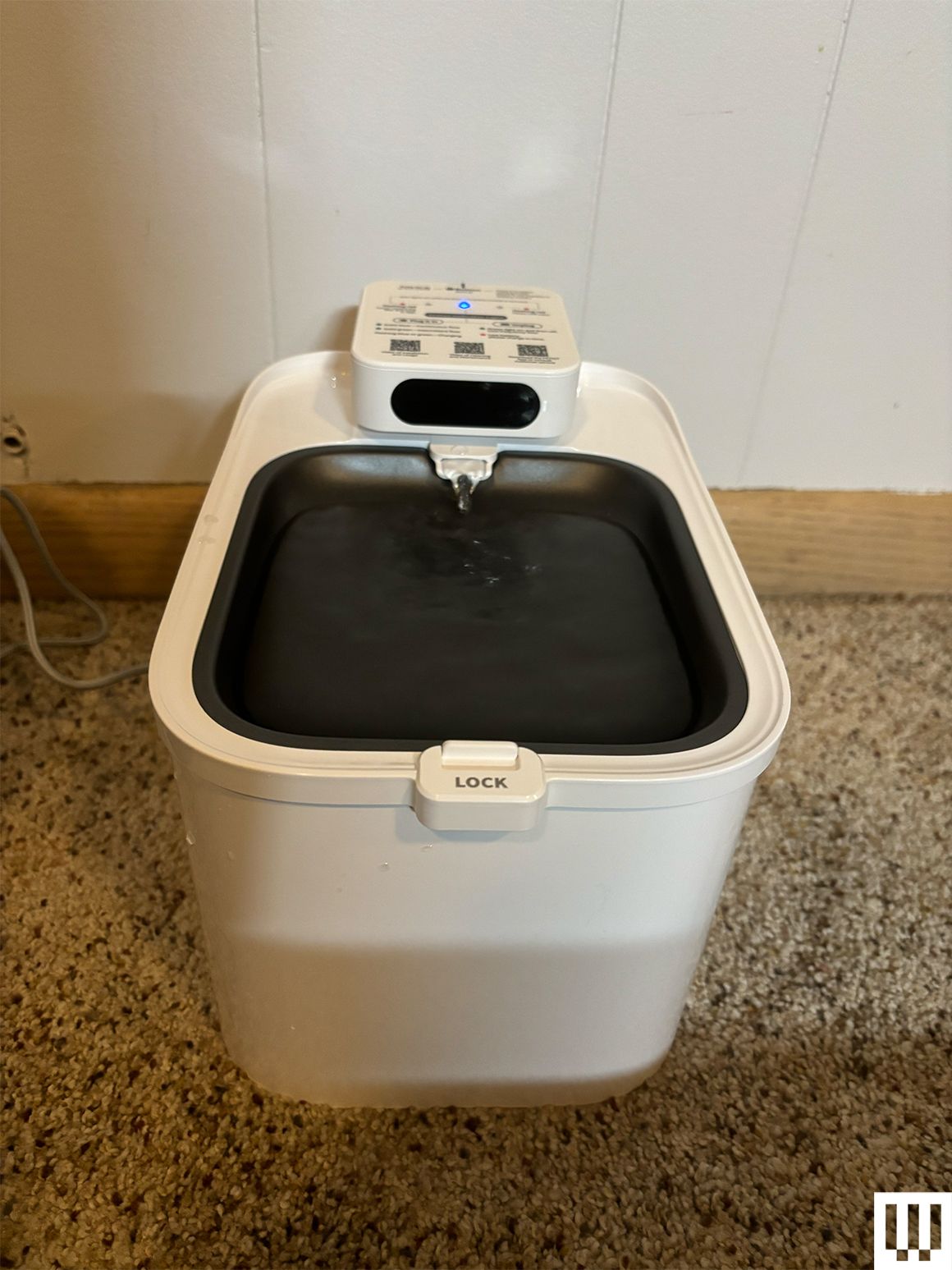 Petkit Eversweet Max a white rounded rectangularshaped water fountain for cats with a small black pan on the top that...