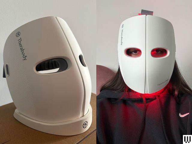 Left: Therabody TheraFace Mask, a white mask on a slim stand on a wooden surface. Right: Person in black hoodie wearing a white facial mask that has red lights on the inside.