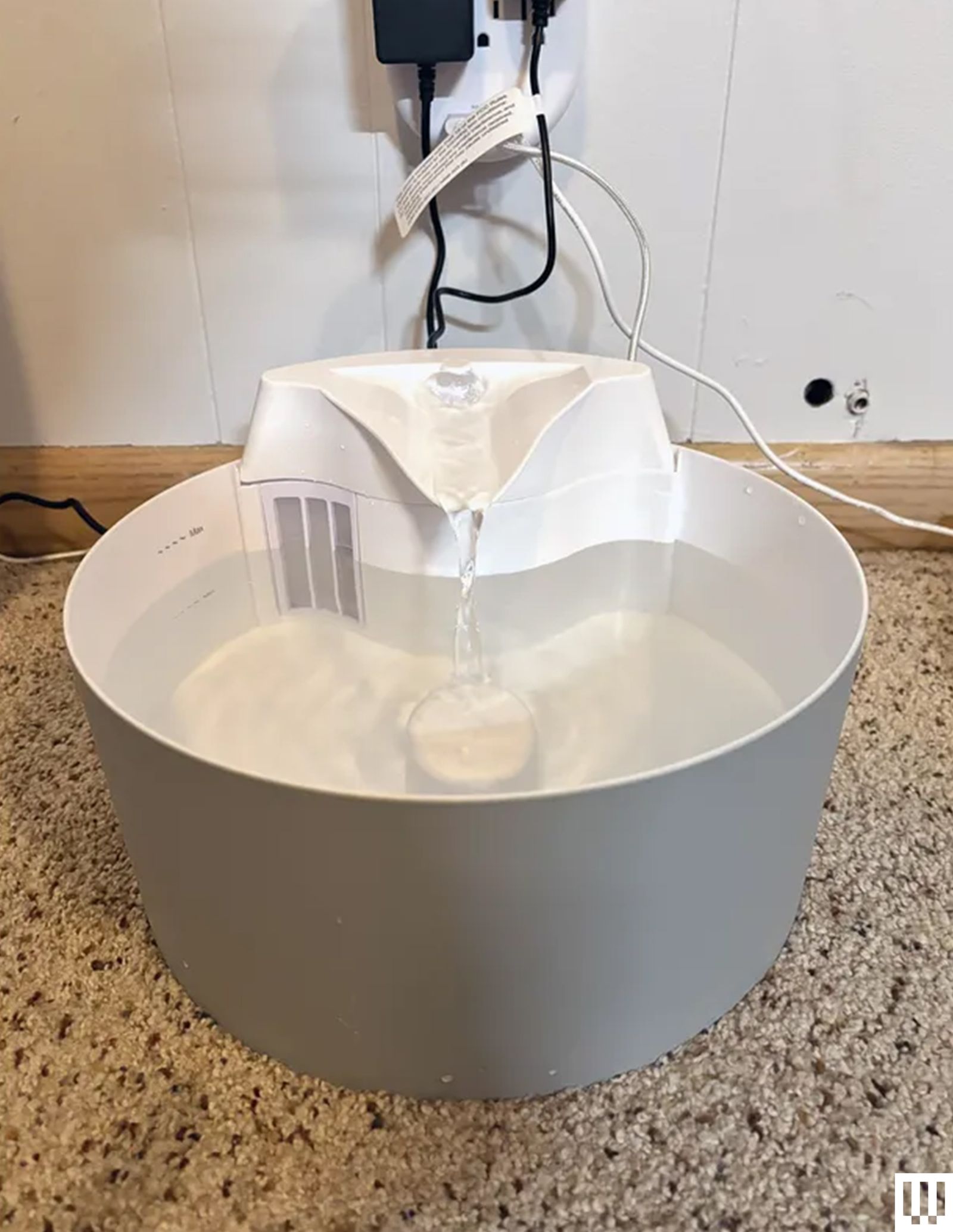 Whisker City Free Fall Cat Fountain a bowl with a ledge spout where water gently pours down below