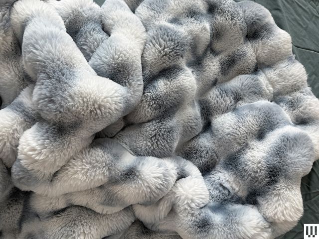 Image may contain: Clothing, Fur, Animal, Bear, Mammal, Wildlife, and Blanket