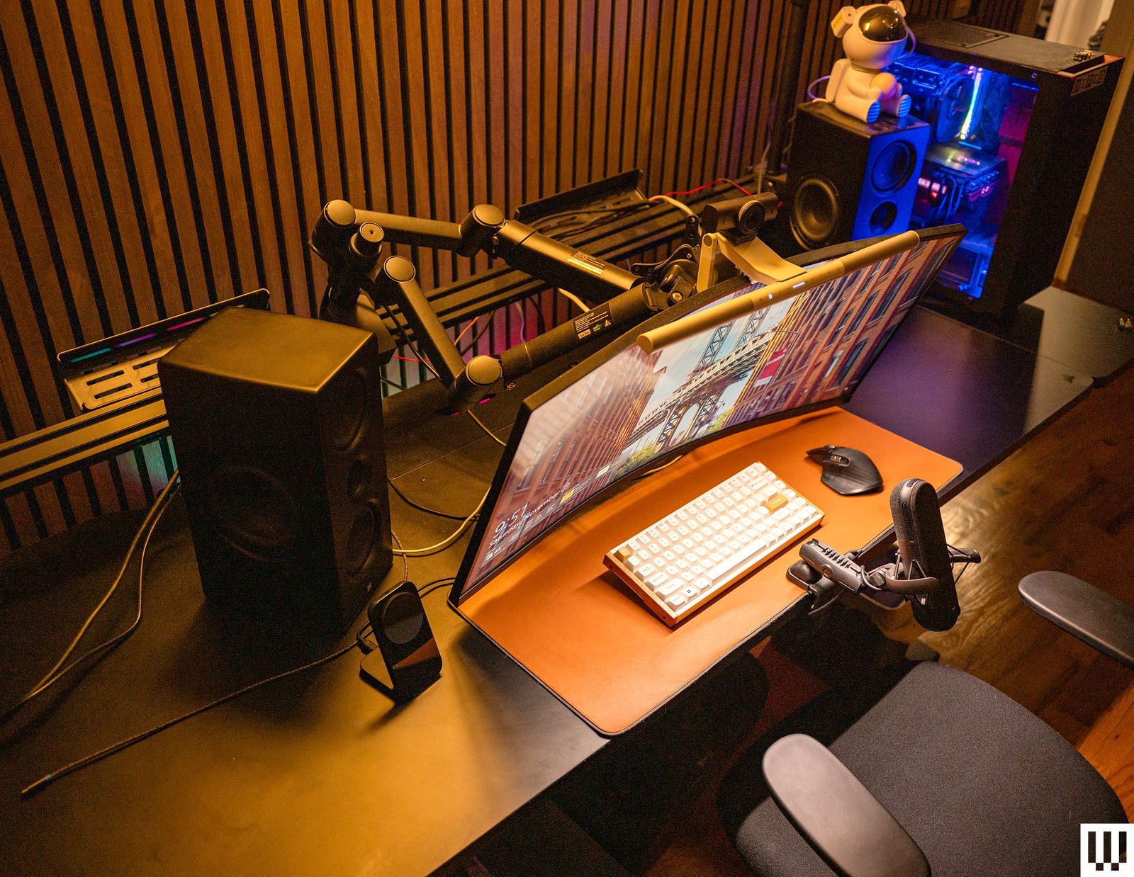 Corsair Platform 6 Desk with a black top and the railing to hold two monitors broken causing the monitor to lean forward