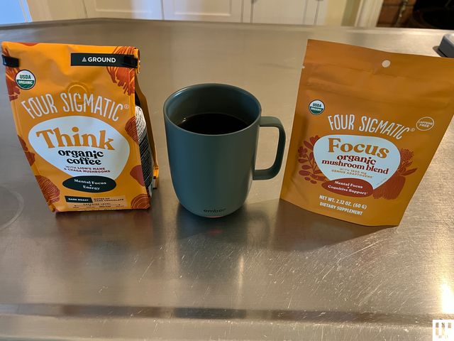 Best Mushroom Coffee, Sigmatic Packaging, and green cup of coffee