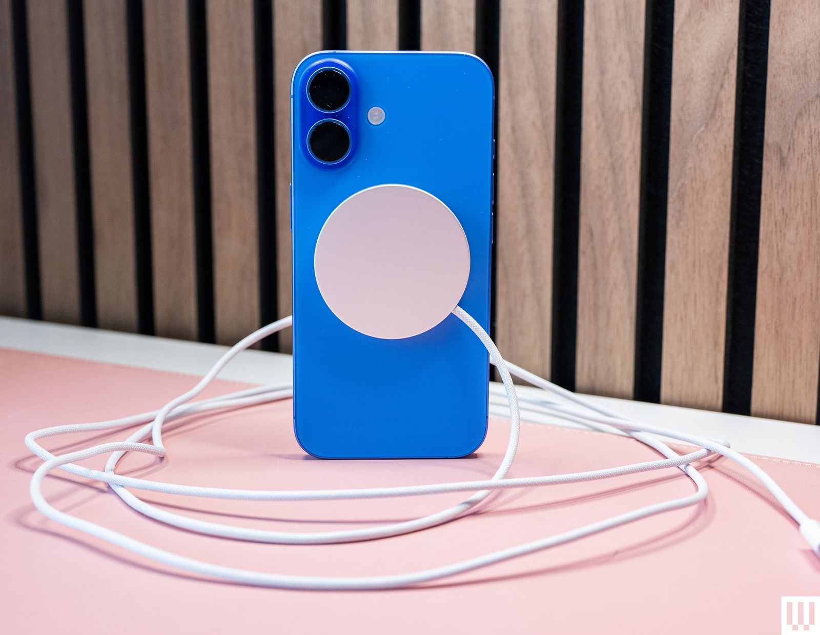 Apple Mag Safe Charger 2M a blue mobile phone case with silver disc in the center with a cord coming from it