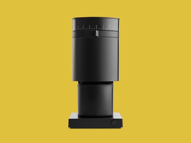 Fellow Opus coffee grinder on yellow backdrop